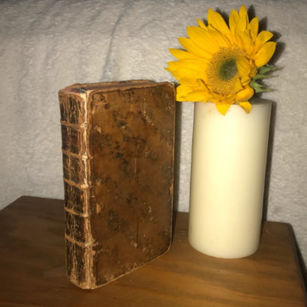 old hardcover book vintage made in 1748 with original calfskin leather cover